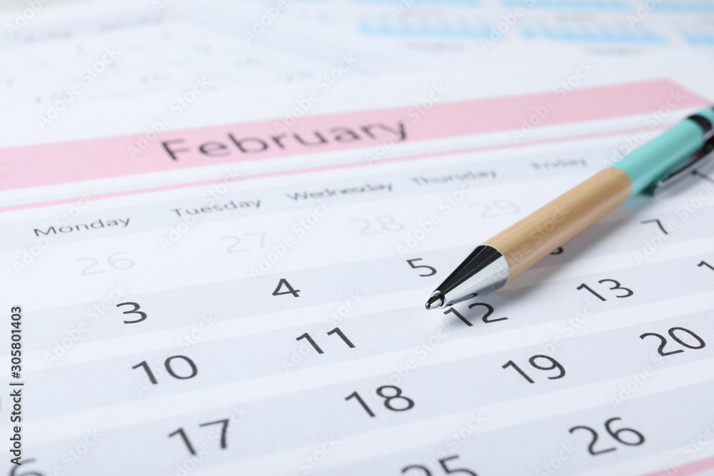 Pen on calendar page, closeup. Planning concept Pen on calendar page, closeup. Planning concept