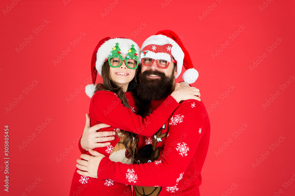 Togetherness. Bearded man and kid. Family celebrate holiday. Family tradition. Merry christmas. Joyful cheerful people. Father and daughter winter sweaters celebrate new year. Happy family hug Togetherness. Bearded man and kid. Family celebrate holiday. Family tradition. Merry christmas. Joyful cheerful people. Father and daughter winter sweaters celebrate new year. Happy family hug