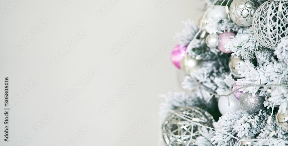 Christmas tree with New Year's balls and a garland. Christmas tree with New Year's balls and a garland.