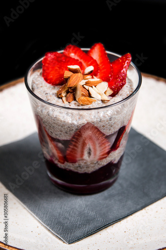 Chia seeds meal with fresh strawberries in a glass