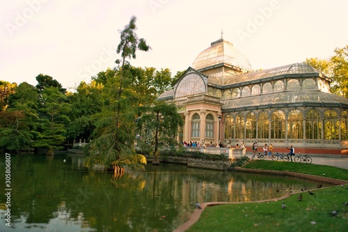 The Palacio de Cristal. "Crystal Palace" is a glass and metal structure located in Madrid's Buen Retiro Park, Spain.