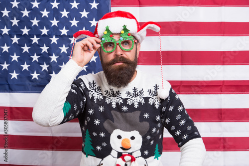 Have red white and blue christmas. Santa on american flag background. Bearded american man celebrate new year. Festive decorations with US flag. National flag. Stars and Stripes. Flag day. Born free © be free