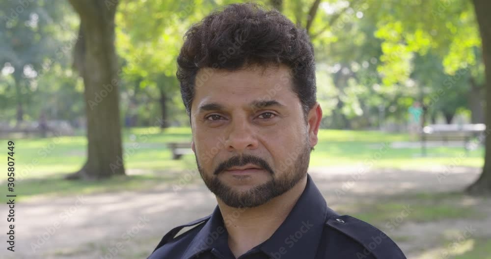 Static shot of a man in a park and staring into the camera - shot on RED Static shot of a man in a park and staring into the camera - shot on RED