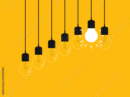 Set of hanging light bulbs with one glowing. Leadership, power and uniqueness concept.