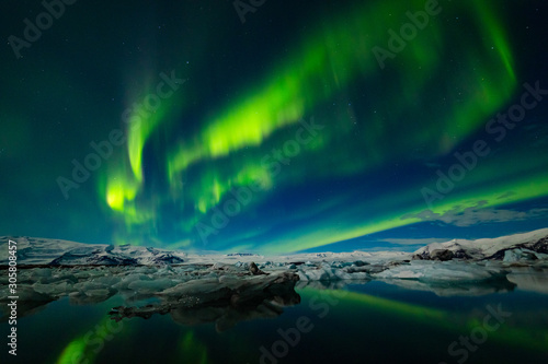 Aurora Borealis over a glacier lagoon in Iceland