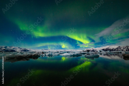 Aurora Borealis over a glacier lagoon in Iceland © Daniel