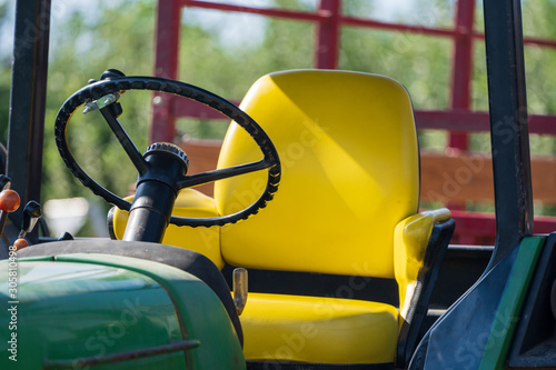 Tractor steering wheel and seat