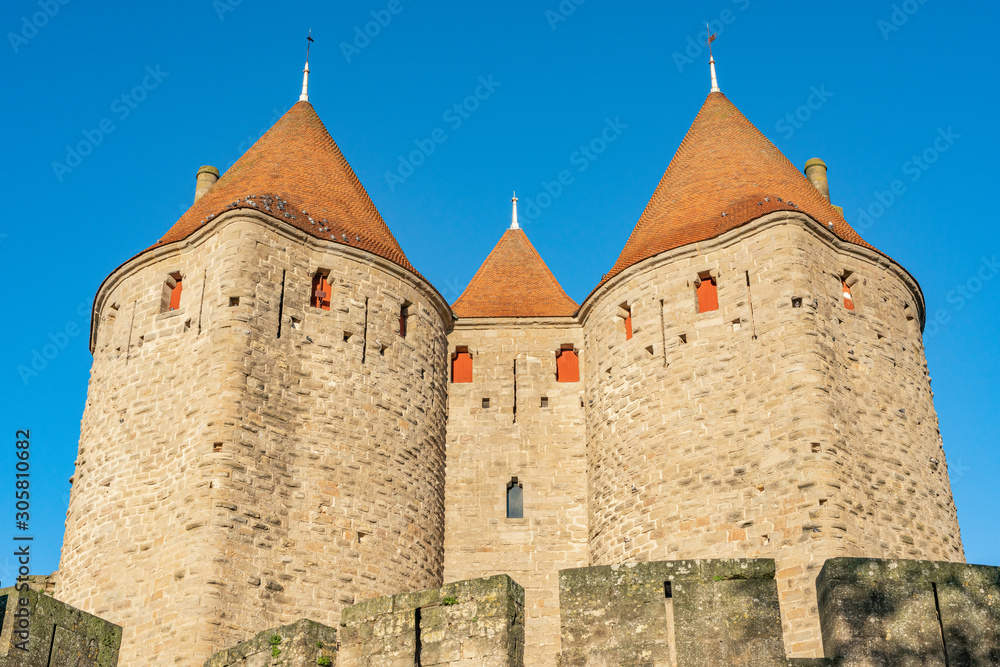 Medieval fortress Cite de Carcassonne in the morning rays of the sun. Carcassonne, France. 26 nov 2019