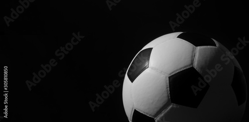 Closeup of football ball on black background