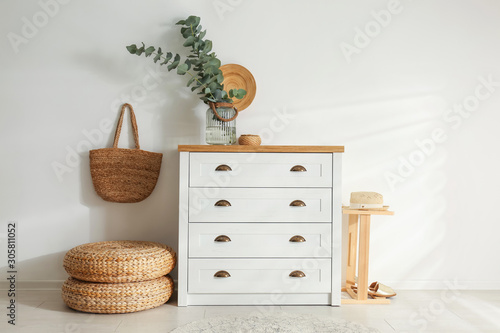 Chest of drawers in stylish room interior photo