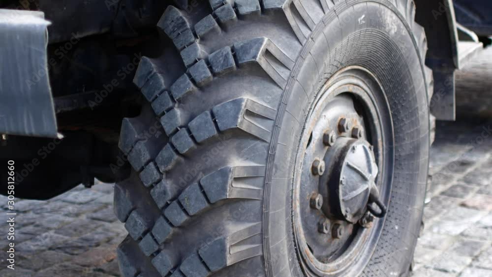 Wheel of a large lorry. Wheel tire on a military vehicle Wheel of a large lorry. Wheel tire on a military vehicle
