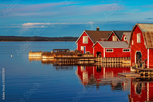Red houses in village scenic landscape, Höga Kusten, Sweden