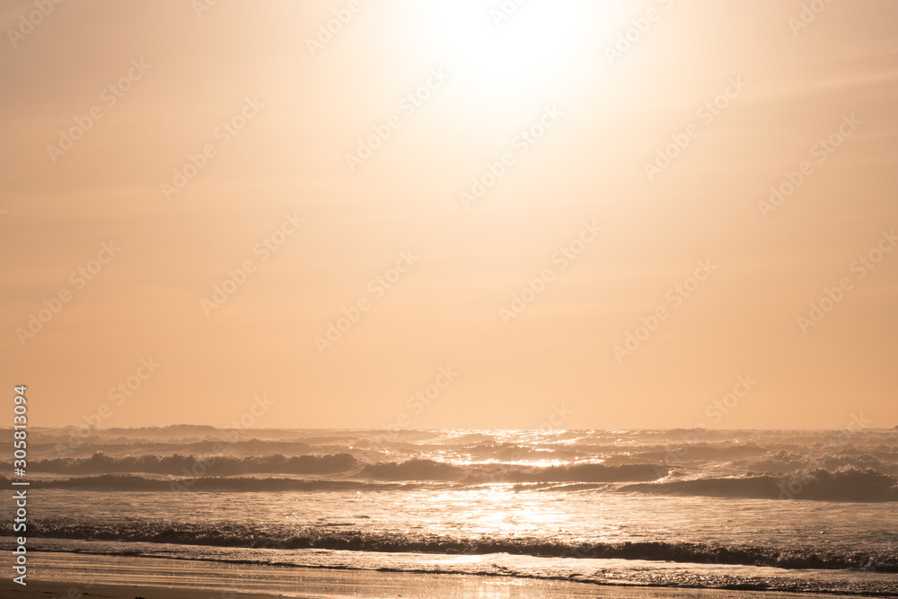 Obraz premium Sandy ocean coast at sunset. Atlantic Ocean, Morocco