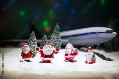 Merry Christmas and Happy new years travel concept background for winter trip on wood background   Travel with airplane top view with copy space.