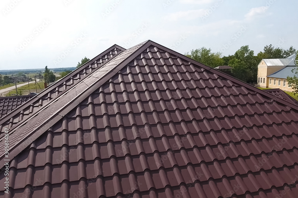 Fototapeta premium Corrugated metal roof and metal roofing. Modern roof made of met