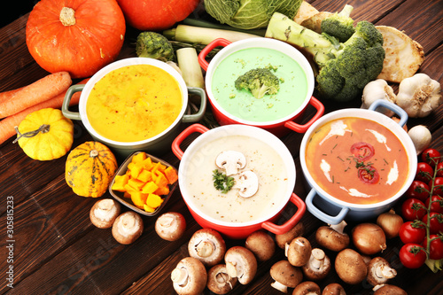 Variety of colorful vegetables cream soups and ingredients for soup. Concept of healthy eating or vegetarian food with mushrooms