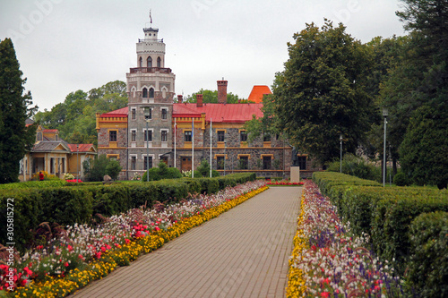 The new castle of Sigulda with the colored flowers photo