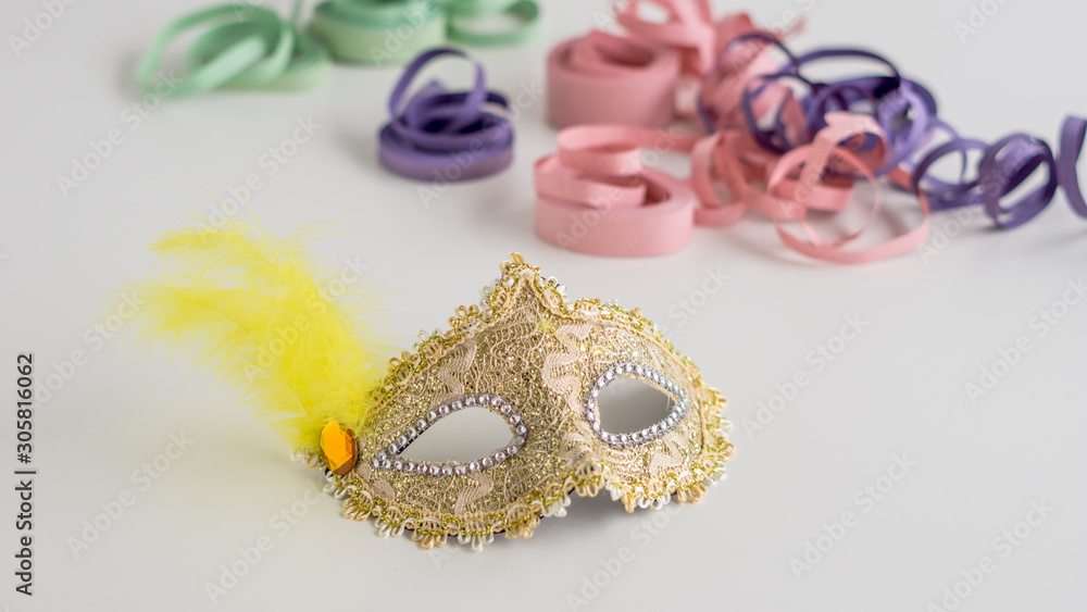 Golden carnival mask close-up on white background Golden carnival mask close-up on white background