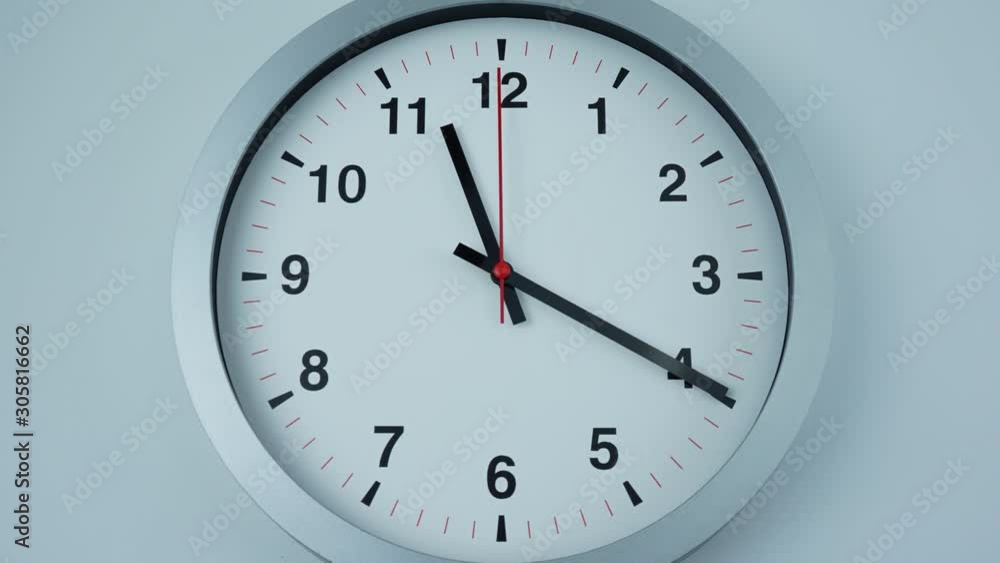 Closeup Zoom out, Gray clock beginning of time 11.00 am or pm, Time lapse 60 minutes moving fast on white background. Closeup Zoom out, Gray clock beginning of time 11.00 am or pm, Time lapse 60 minutes moving fast on white background.