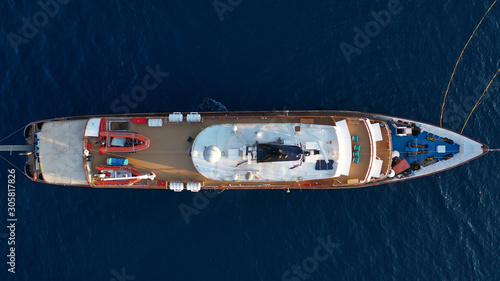 Aerial top down photo of luxury yacht in deep blue Mediterranean sea