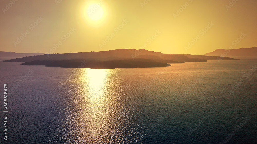 Aerial drone photo of beautiful sunset as seen from main village of Mykonos island, Cyclades, Greece