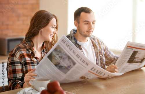 Beautiful young couple read...