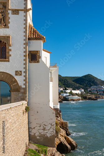 Facade of the walls of the Catholic Church Parróquia de Sant Bartomeu i Santa Tecla. Sitges, Spain. 26 nov 2019