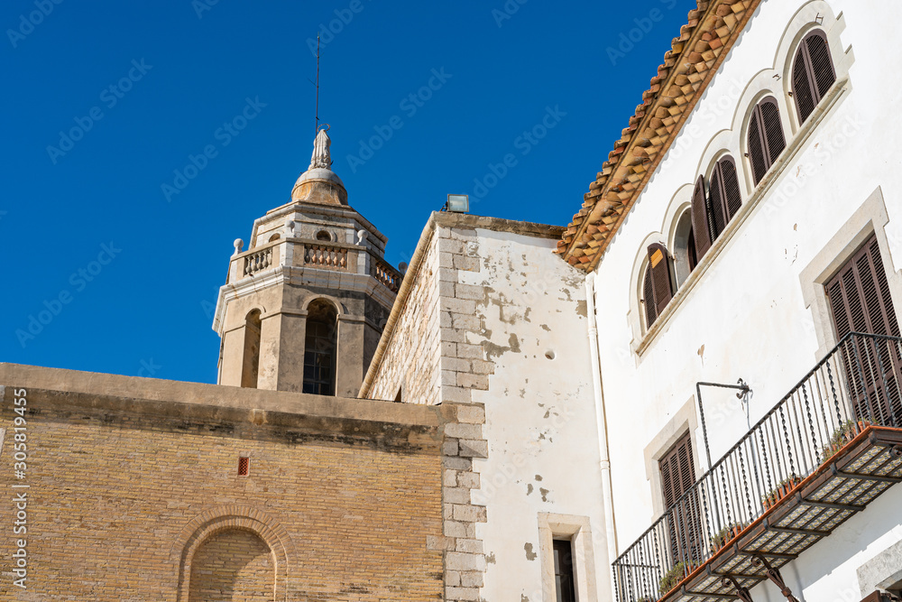 Facade of the walls of the Catholic Church Parróquia de Sant Bartomeu i Santa Tecla. Sitges, Spain. 26 nov 2019