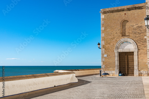 Facade of the walls of the Catholic Church Parr  quia de Sant Bartomeu i Santa Tecla. Sitges  Spain. 26 nov 2019