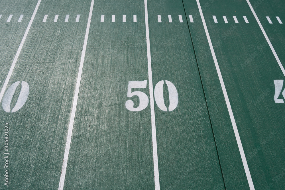 the 50 yardline marker at a football field indicates mid field position