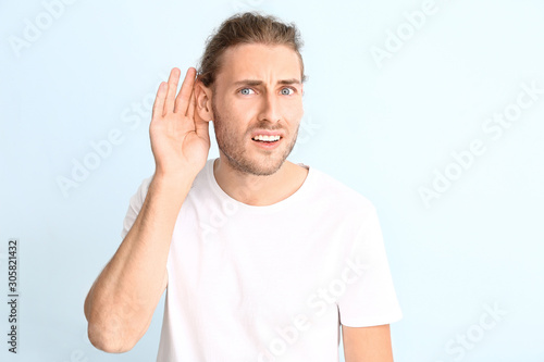 Young man with hearing prob...