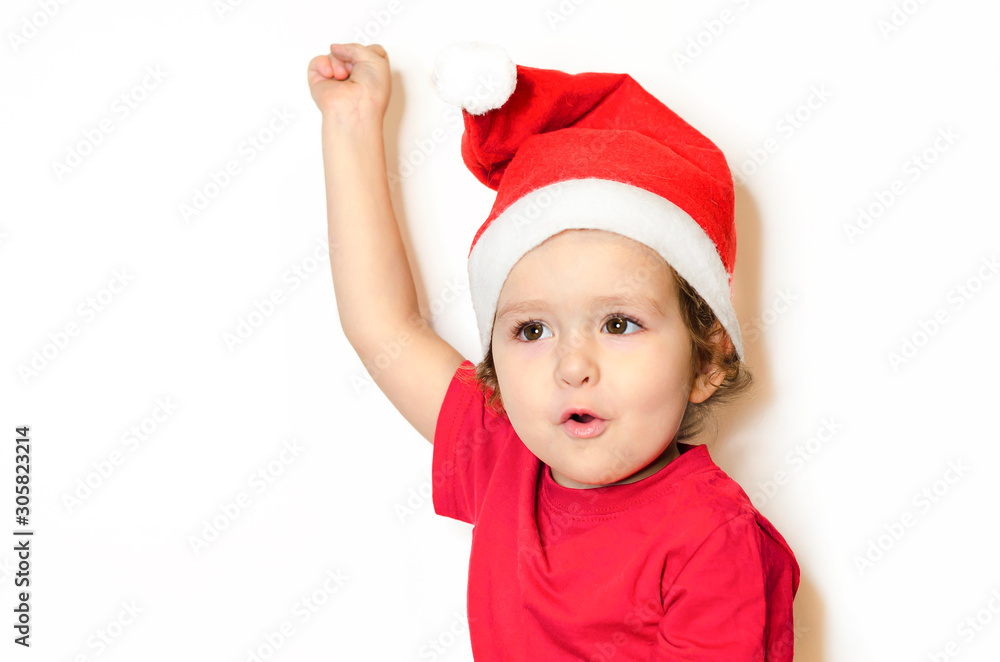 Portrait little happy girl in festive clothes and santa claus hat. Cute baby in Christmas clothes waits and enjoys the holiday. beautiful baby in a red dress isolated on white. Portrait little happy girl in festive clothes and santa claus hat. Cute baby in Christmas clothes waits and enjoys the holiday. beautiful baby in a red dress isolated on white.
