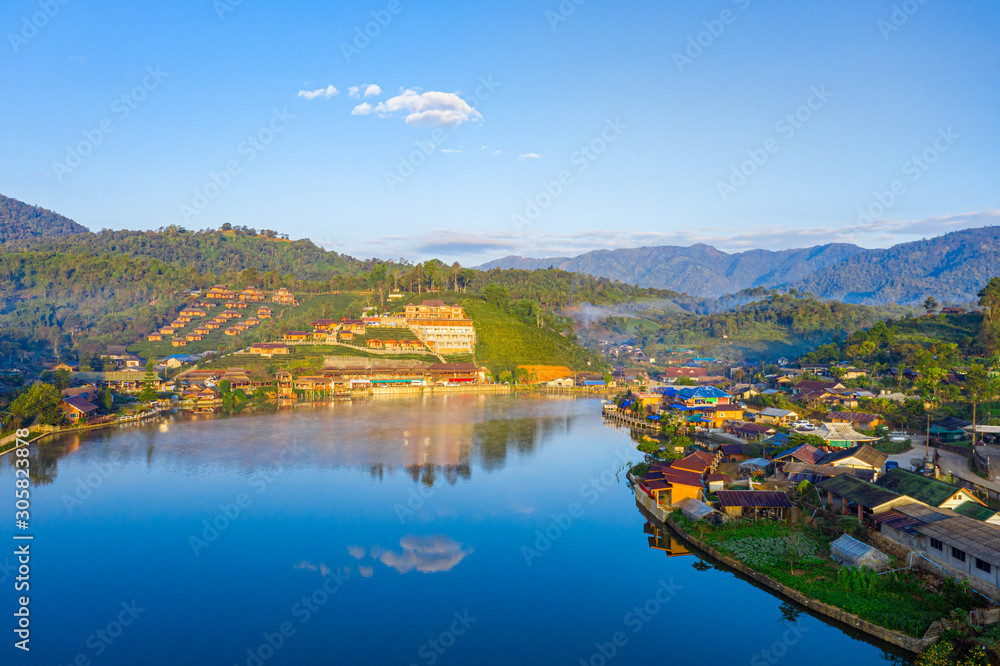 Aerial landscape of Ban Rak Thai with sunrise in the morning located in Maehongsan province, Thailand.