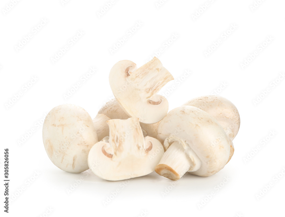 Fototapeta premium Fresh champignon mushrooms on white background