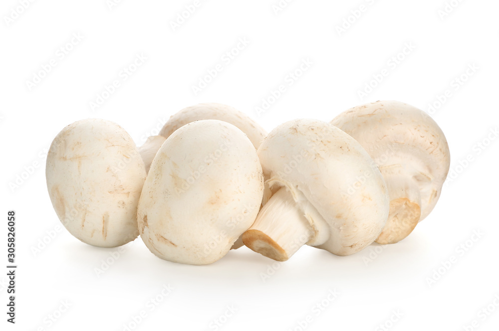 Fresh champignon mushrooms on white background