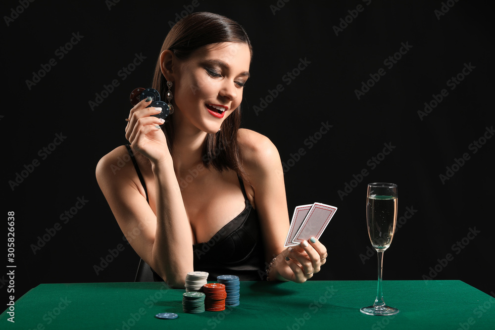 Female poker player at table in casino Female poker player at table in casino