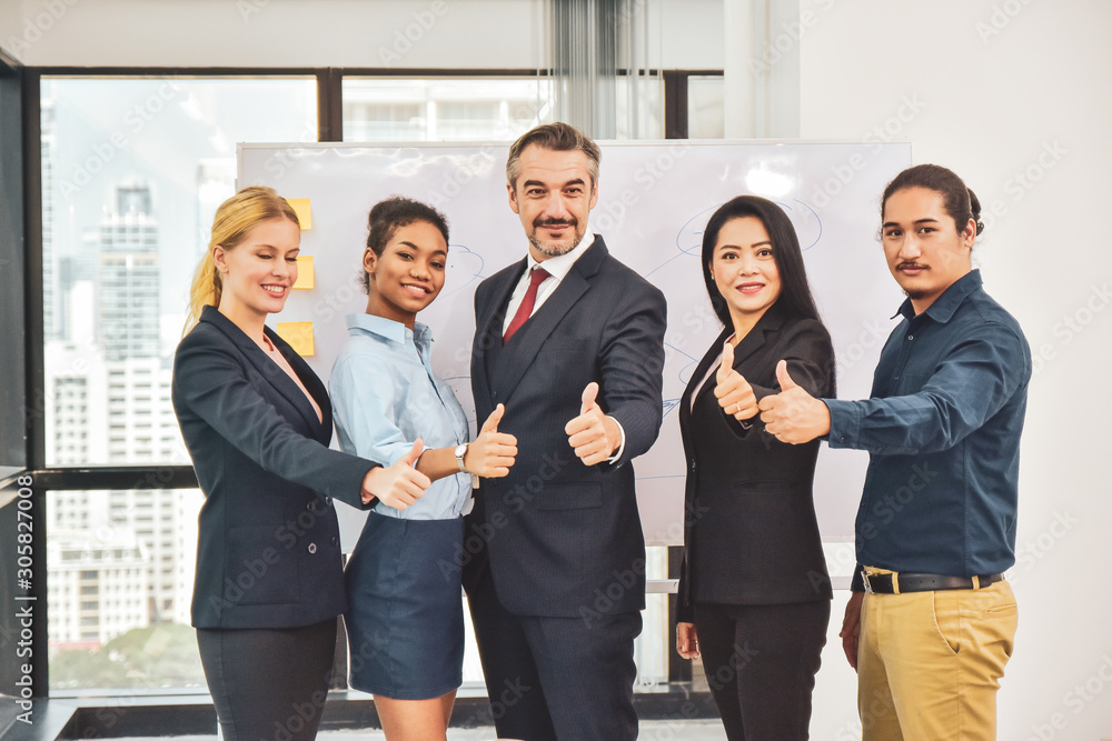 Business team standing in meeting room Thump up Success concept ,Business manager leadership thump up success Business team standing in meeting room Thump up Success concept ,Business manager leadership thump up success