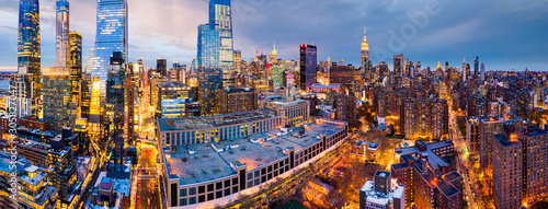 Aerial panorama of New York City skyscrapers at dusk as seen from above the 10th avenue and 29th street  close to Hudson Yards and Chelsea neighborhood