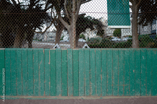 Photography green fence at the park back of baseball diamond