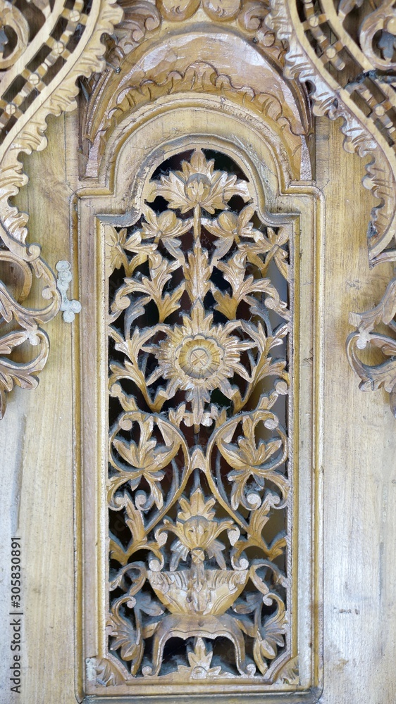 Beautiful handcrafted woodwork on a wall Beautiful handcrafted woodwork on a wall