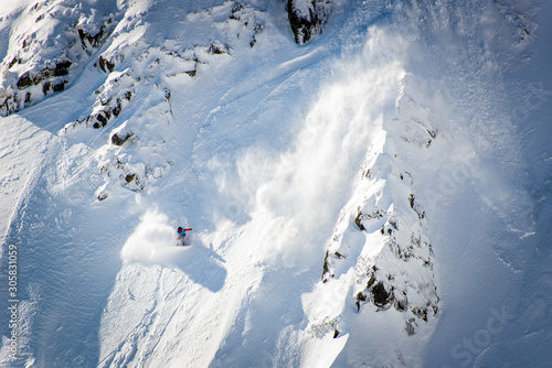 Fotobehang Snowboarder, Skier caught in the snow avalanche