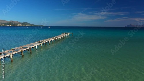 Wallpaper Mural flying over a wooden pier in the sea at Alcudia beach Majorca Spain Torontodigital.ca