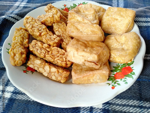 Traditional indonesian culinary food. Tahu Goreng and Tempe Goreng Indonesian Food that is simple and often made at home. Indonesian Street Food. fried tempe and fried tofu.