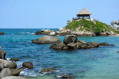 blue beaches and contrast of rocks and jungle in the national natural park tairona colombia photo