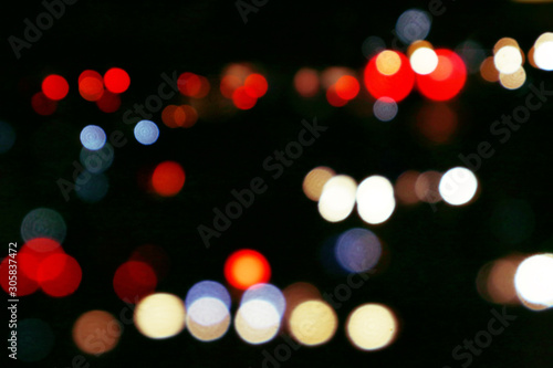 Bokeh night ligh Beautiful bokeh light on a black background with various colors, Blurred of car in city at night © Ronny sefria