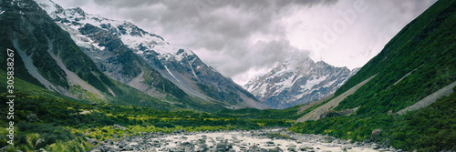 Hooker Valley Track hiking trail, New Zealand. View of Aoraki Mount Cook National Park with snow capped mountains. Banner panorama landscape.