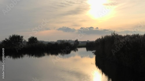 Sunset at 'De Zweth' river in Oude Leede, the Netherlands photo