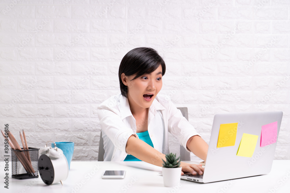 Happy woman sitting at home office and feel surprised Happy woman sitting at home office and feel surprised