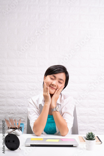 Portrait of a confidence woman sitting at office