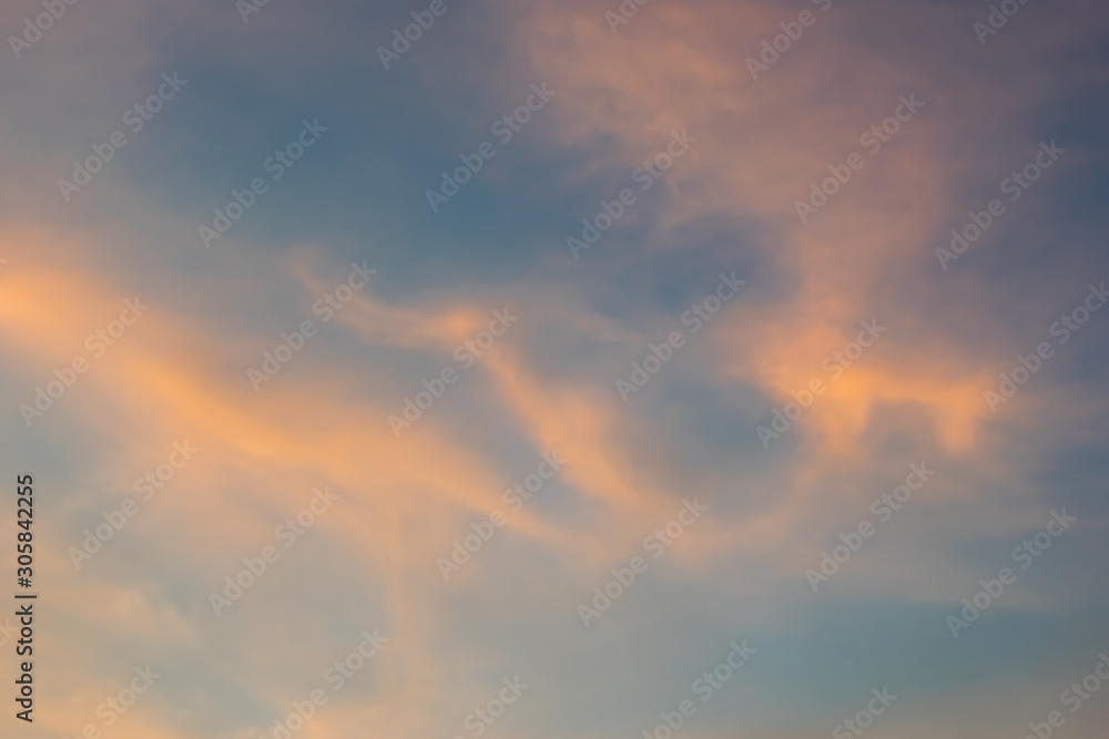 Blue and orange sky with many cloudy background, twilight sky after sunset.